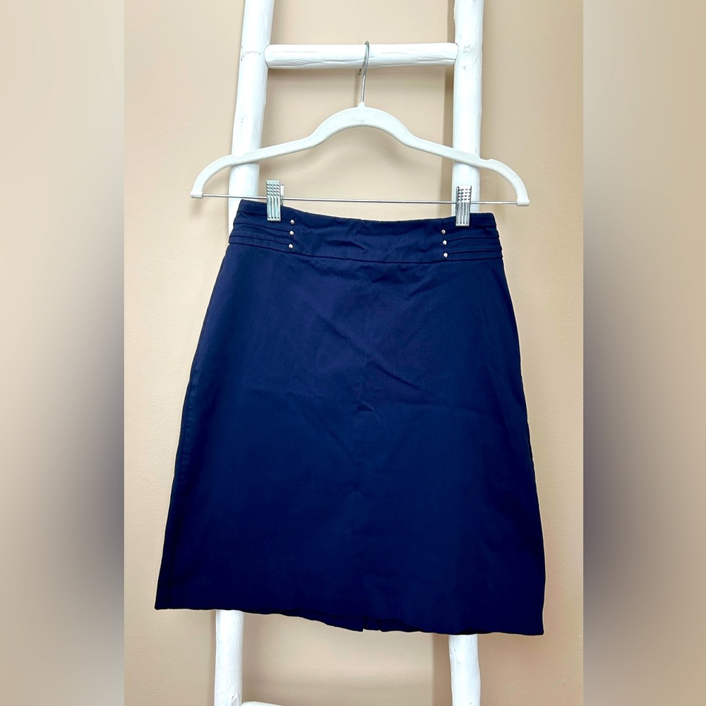 Size small petite, navy blue skirt with silver bead design at waistline.